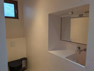 a bathroom with a sink and a mirror at Geldmunt 37 in Ghent