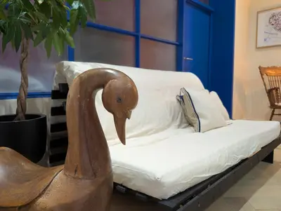 a wooden swan sitting on a couch in a living room at Geldmunt 37 in Ghent
