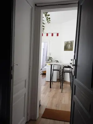 a door leading into a dining room with a table at Nest in Brussels in Brussels