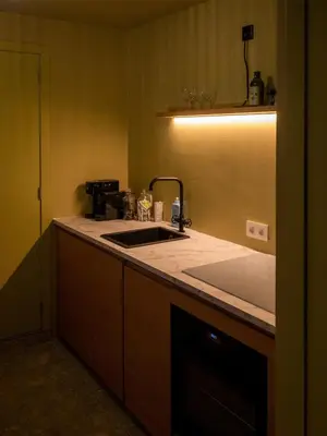 a kitchen with a sink and a counter top at Spacious home in the heart of Antwerp! in Antwerp