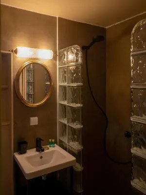 a bathroom with a sink and a shower at Spacious home in the heart of Antwerp! in Antwerp