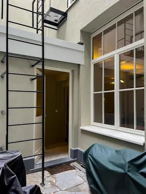 a front door of a house with a window at Spacious home in the heart of Antwerp! in Antwerp