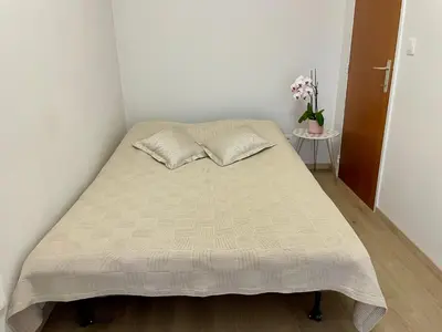 a bed with two pillows on it in a room at Bright & Peaceful Appartment in Koningslo in Vilvoorde