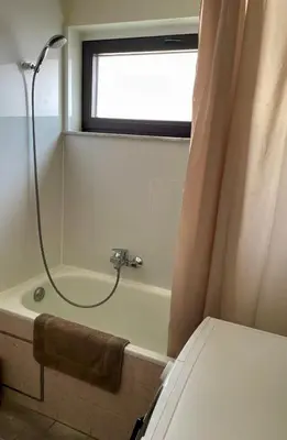 a bathroom with a shower and a bath tub at Bright & Peaceful Appartment in Koningslo in Vilvoorde