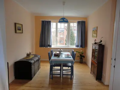 a dining room with a table and chairs and a window at Guest House Dasos Kynthos in Brussels