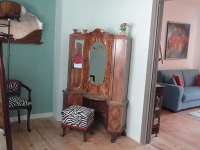 a room with a large mirror and a couch at Guest House Dasos Kynthos in Brussels