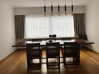 a dining room with a table and four chairs at RS10 One-Bedroom Apartment in Turnhout