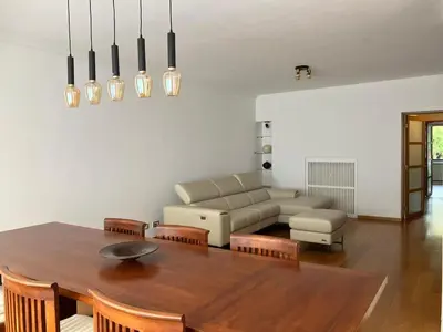 a living room with a table and a couch at RS10 One-Bedroom Apartment in Turnhout