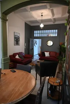 a living room with a table and a couch at Cozy Apartment in Brussels of 75 m² in Brussels