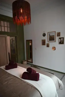 a bedroom with a bed with red towels on it at Cozy Apartment in Brussels of 75 m² in Brussels