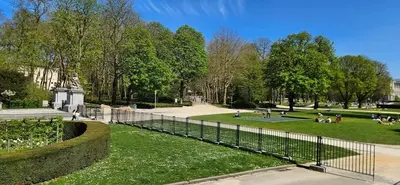 a park with people sitting in the grass at Cozy Apartment in Brussels of 75 m² in Brussels