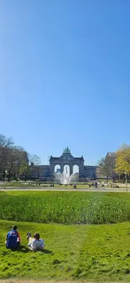 a group of people sitting in the grass in a park at Cozy Apartment in Brussels of 75 m² in Brussels