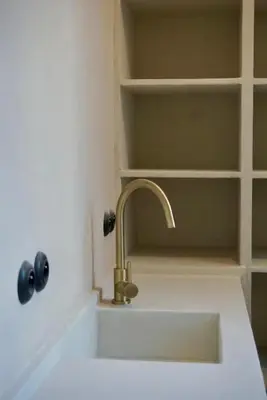a sink with a faucet in a bathroom at Stylish apartment in 16th century city palace! in Antwerp