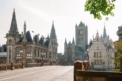 a city street with many buildings and a bridge at La Petite Foret Stylish City Apartment Ghent in Ghent