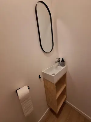 a bathroom with a sink and a mirror on the wall at Funky Jungle house - Rustig gelegen rijwoning in hartje Mechelen in Mechelen