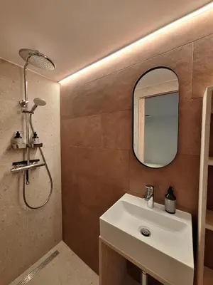 a bathroom with a sink and a mirror at Funky Jungle house - Rustig gelegen rijwoning in hartje Mechelen in Mechelen
