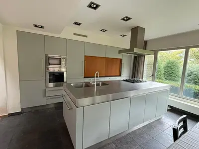a kitchen with a sink and a stove top oven at zandhoven vila in Zandhoven
