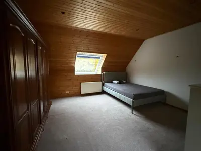 a bedroom with a bed and a window in a room at zandhoven vila in Zandhoven