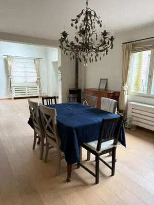 a dining room with a blue table and chairs at zandhoven vila in Zandhoven