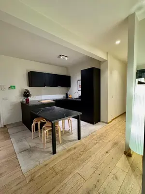 a dining room with a table and chairs at The Twin Suites Apartment in Brussels