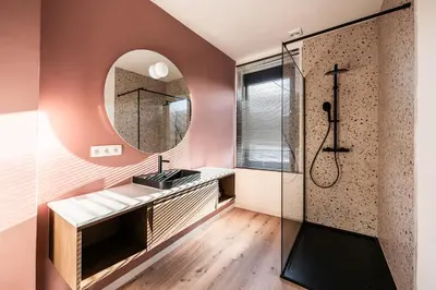 a bathroom with a sink and a mirror at Spacious 5-room house near Brussels with private parking in Steenokkerzeel