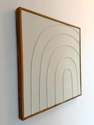 a picture frame with a painting on a wall at NEW Luna residences - in the city center in Antwerp