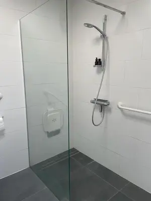 a shower with a glass door in a bathroom at Zalig verblijf in hartje Gent in Ghent