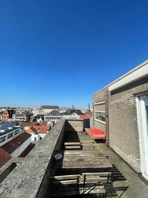 a rooftop of a building with a view of a city at Zalig verblijf in hartje Gent in Ghent