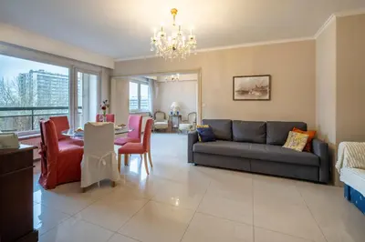 a living room with a couch and a table at Brussels Expo Elegant residence in Brussels
