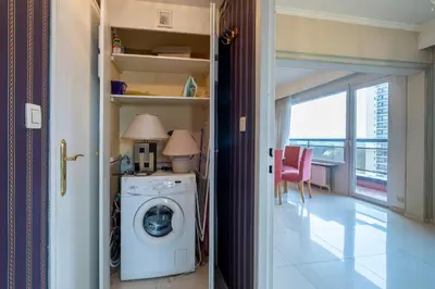 a laundry room with a washing machine and a window at Brussels Expo Elegant residence in Brussels