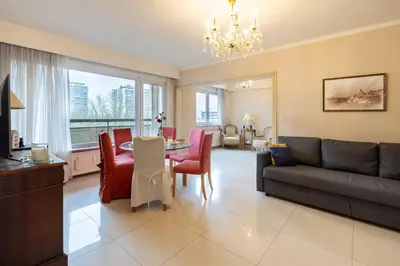 a living room with a couch and a table at Brussels Expo Elegant residence in Brussels