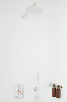 a white wall with two shelves and a lamp at Stylish Apartment City Center in Antwerp