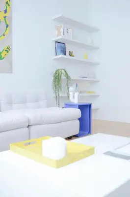 a living room with a white couch and a table at Stylish Apartment City Center in Antwerp