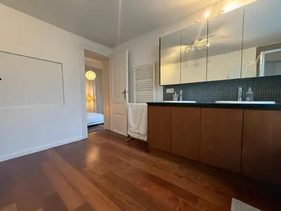 a kitchen with a sink and a counter top at Un paradis au coeur de Bruxelles in Brussels