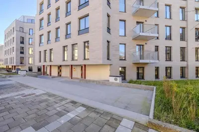 an empty street in front of a large building at Stay at Brussels studio apartment in Brussels