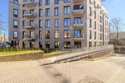 a large building with a sidewalk in front of it at Stay at Brussels studio apartment in Brussels