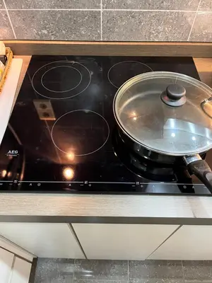 a pan sitting on top of a stove in a kitchen at Central in Ghent