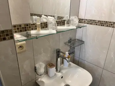 a bathroom with a sink and a mirror at Central in Ghent