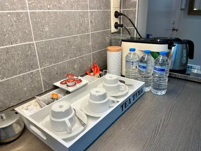 a tray with dishes and water bottles on a counter at Central in Ghent