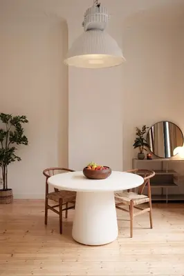 a white table with a bowl of fruit on it at Cozy Parisian-Style Flat in Antwerp Zuid in Antwerp