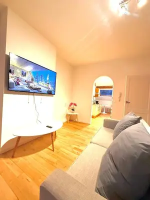 a living room with a couch and a table at EU District Loft in Brussels