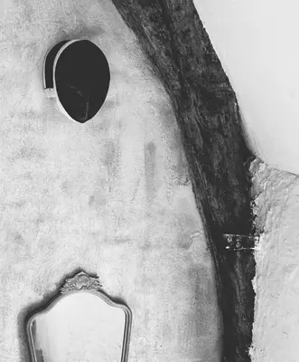 a black and white photo of a mirror on the floor at The Mystical Suite in Antwerp