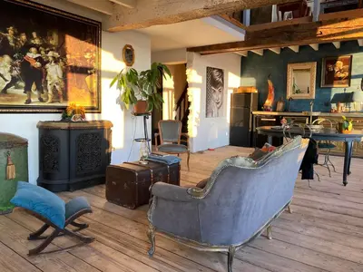 a living room filled with furniture and a fireplace at The Mystical Suite in Antwerp