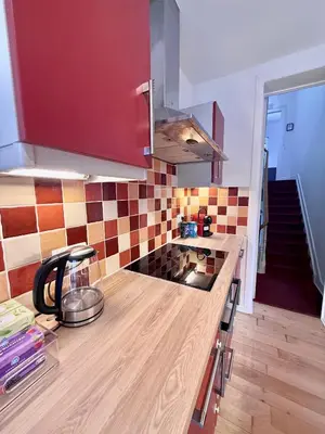 a kitchen with a wooden counter top in a room at Schuman Square Residence in Brussels