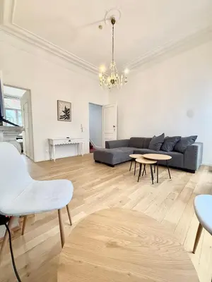 a living room with a couch and a table at Schuman Square Residence in Brussels