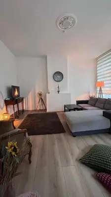a living room with a couch and a table at Appartement Bruxelles 1 in Brussels