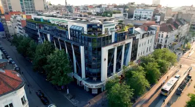 an aerial view of a building in a city at Sunset Paradise Tomorrowland hotel and transport at Hyllit Antwerp in Antwerp
