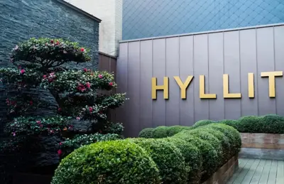 a sign for the hyll hotel in front of a building at Sunset Paradise Tomorrowland hotel and transport at Hyllit Antwerp in Antwerp