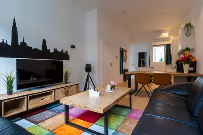 a living room with a couch and a table at heartatd'Anvers Original in Antwerp