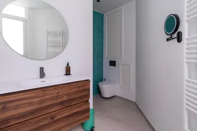 a bathroom with a sink and a mirror at heartatd'Anvers Original in Antwerp